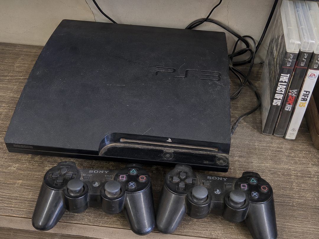 PS3 console with 2 controllers